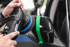 KochChemie Micro Cut product on a rupes polisher polishing a car side mirror.