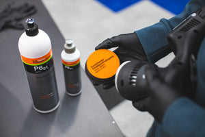 KochChemie One Cut Pad being attached to a rupes polisher with both sizes of One Cut & finish