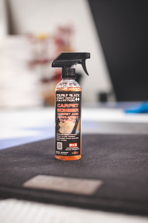 P&S Carpet Bomber 16oz bottle sitting on top of a black carpet.