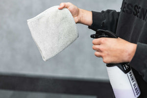 Person spraying a FTW Ice Grey with an iK Sprayer.