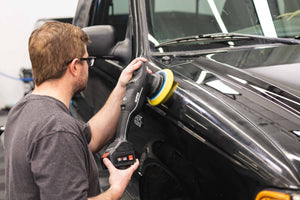 Rupes Da fine yellow polishing pad attached to a polisher polishing a ranger.