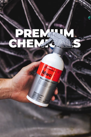 Person holding a bottle of MWC Magic Wheel Cleaner with 'Premium Chemicals' text overlayed.