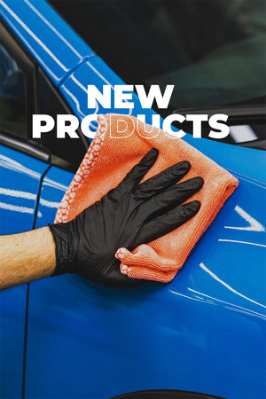 Person cleaning a blue car with an orange cloth and black glove, text 'NEW PRODUCTS' overlayed.