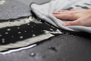 Slim Dryer 25 x 35 Grey wiping up water on a ford raptor.