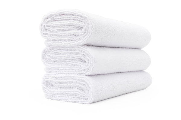 A stack of white sport workout towels.