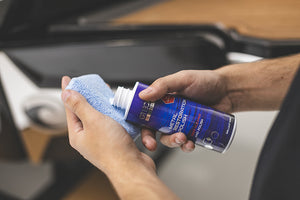 Terry Sponge 2 x 4 Blue with Gtechniq Metal Restoration Polish being poured onto it.