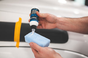 Terry Sponge 2 x 4 Blue with Solution Finish Over The Top Plastic Sealer being poured onto it.