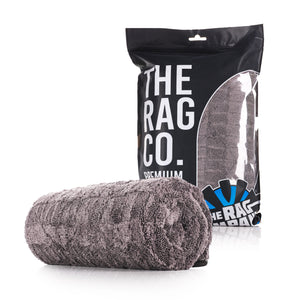 TRC The Gauntlet 30x36 rolled towel on a white background with packaging. 