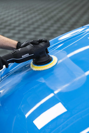 The Last Detail Last Cut Plus being use on a polisher to polish a car.