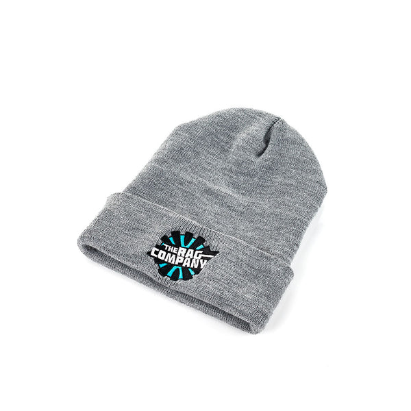 A grey beanie with an embroidered full color logo for the Rag Company. The logo is black, blue, and white