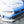 A blue car with soap on it from using a TRC Ultra H2O Foam Cannon to spray soap onto it.