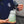 A person holding the top of a TRC Ultra H2O Foam Cannon to show the weighted tube.