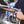 A close up of a person connecting a TRC Ultra H2O Spray Wand to a Spray Gun.