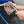 A person connecting a TRC Ultra H2O Spray Gun to a pressure washer hose.