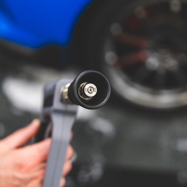 A close up of a TRC Ultra H2O Spray Nozzle spray view with a blurry background.