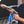 A close up of a person connecting a TRC Ultra H2O Spray Wand to a Spray Gun.