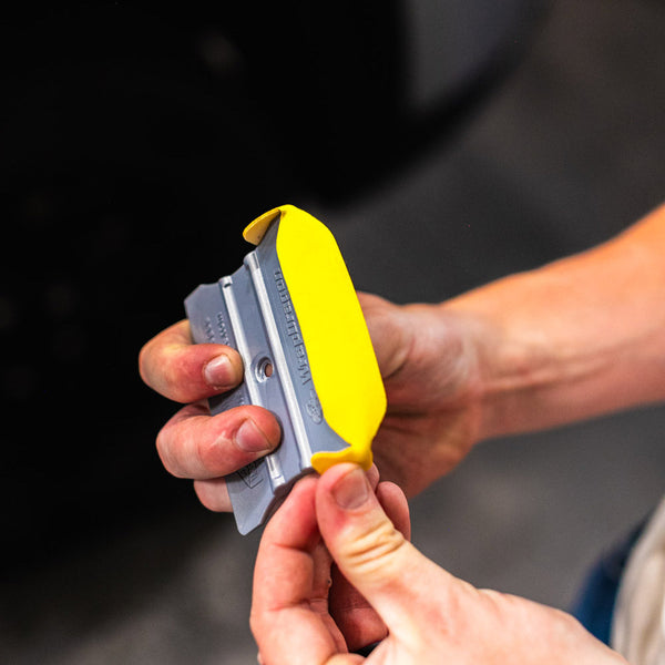 A person prepping the Yellotools Squeegee.