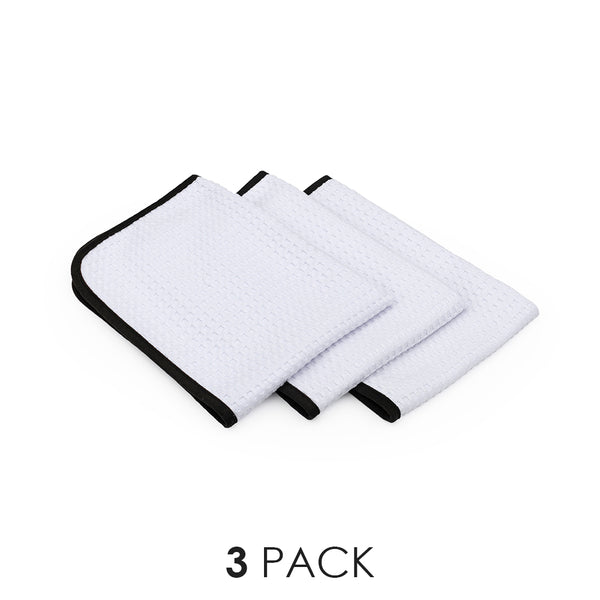 A picture of the 3 pack of Dry Me A River waffle weave microfiber towels from The Rag Company in White