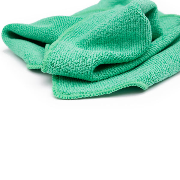 A close-up shot of a stack of 5 Pearl towels from The Rag Company in a green color, measuring 16 inches by 16 inches.