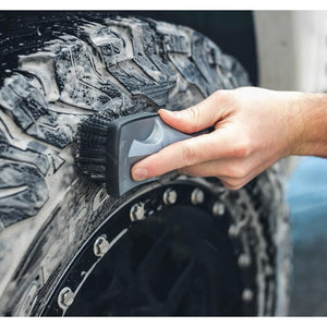 The Rag Company Wheel and Tire Brush Demo cleaning a tire.