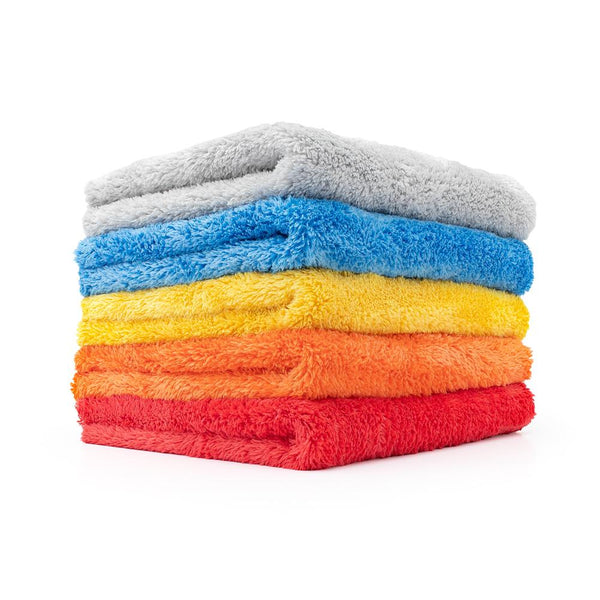 A view of a stack of Eagle Edgeless 500 towels from the Rag Company. These 16 inch by 16 inch towels come in 5 sizes: Ice Grey, Blue, Yellow, Orange, and Red. 