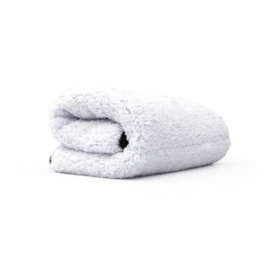 White folded microfiber towel on a white background