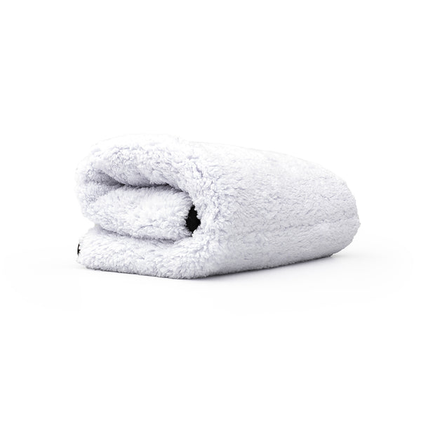 White folded towel on a white background