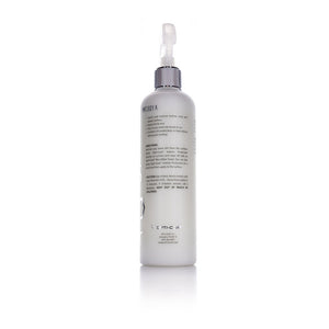 The back of a spray bottle of Opti-Coat Protectant Plus on a white background.
