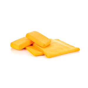A set of bright yellow microfiber towels and pads neatly stacked against a white background. The set includes two rectangular pads and two folded towels, showcasing the soft, absorbent texture of the microfiber material.