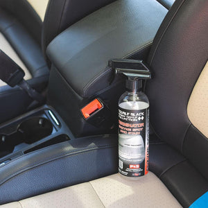 P&S Terminator Enzyme Spot and Stain Remover sitting on a vehicle chair.