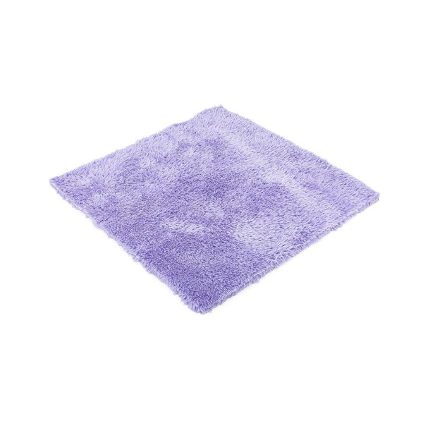 Purple microfiber towel on a white background