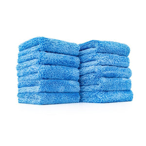 Ten Blue microfiber wash cloths stacked into two piles of five on a white background