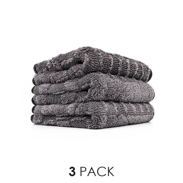 An image of the 3 pack of 12 inch by 12 inch Gauntlet Towels from The Rag Company. These towels are Ice Grey on One side and Gauntlet Grey on the other with a scratcheless suede edge banding them together