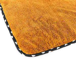 The corner of the brown wolfpack towel on a white background.