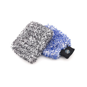 A Black and white wash pad and a Blue and White wash Mitt on a white background.