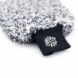 The Cyclone Ultra Wash Mitt from The Rag Company. It has a black and white twist loop microfiber with a patented microfiber liner, and a long cuff with the TRC logo