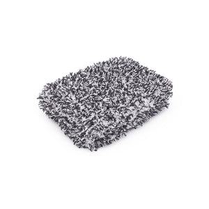 The Cyclone Ultra Wash Pad on a white background.  The Pad is made of white and black microfiber